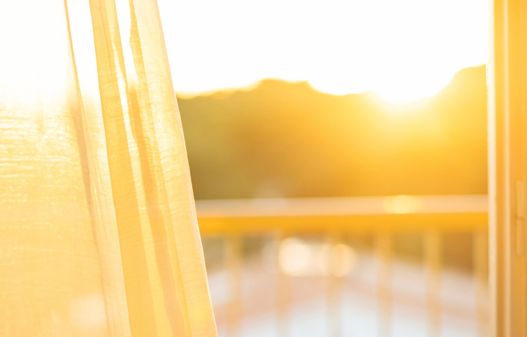Sunlight through sheer curtains